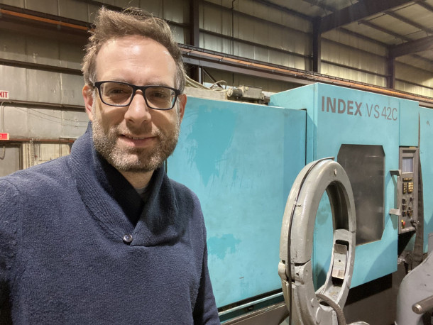 Noah Graff with an INDEX MS42C CNC Multi-Spindle like the one he sold from Spain