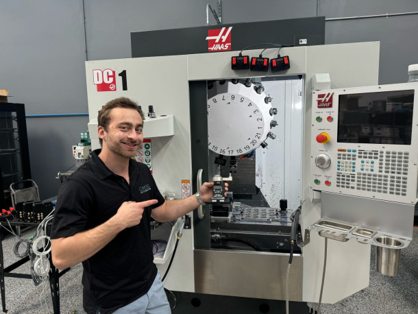  Michael Gimbel holding a CNC mill robot gripper